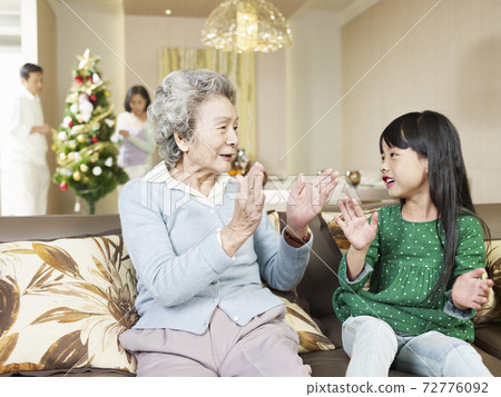 asian grandma and granddaughter playing at home asian grandma and granddaughter playing at home 72776092
