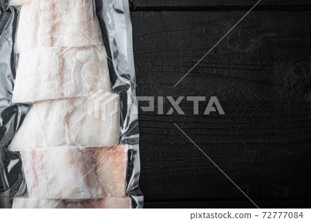 Raw haddock fish skinless, plastic vacuum packaged, top view with copy space for text 72777084