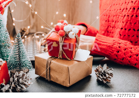 Christmas online shopping, work and education. New Year decorations on table. Woman with notebook computer at home. Winter holidays sales Christmas online shopping, work and education. New Year decorations on table. Woman with notebook computer at home. Winter holidays sales 72777172