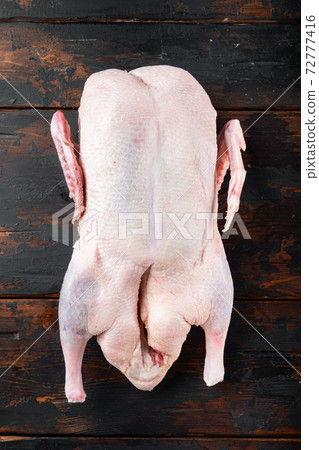 Recipe for cooking whole duck on old dark wooden table, flat lay Recipe for cooking whole duck on old dark wooden table, flat lay 72777416