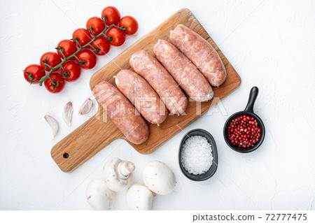 Raw pork sausages, top view, on white background 72777475