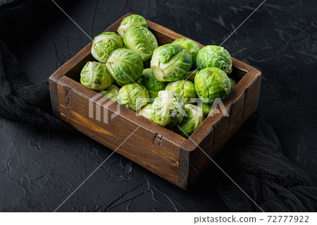 Brussels sprouts, on black textured background Brussels sprouts, on black textured background 72777922