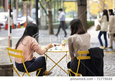 Two women having lunch outside Two women having lunch outside 72778688