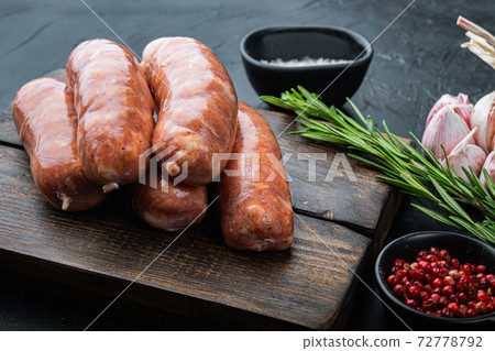 Homemade raw pork sausages, on black background 72778792