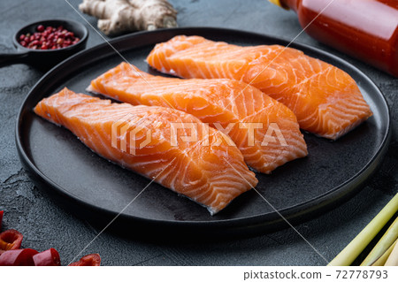 Fish patties ingredients with salmon and lemongrass, on grey background 72778793