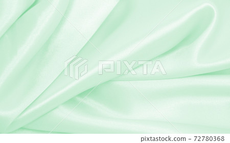 Smooth elegant green silk or satin luxury cloth texture as abstract background. Luxurious background design Smooth elegant green silk or satin luxury cloth texture as abstract background. Luxurious background design 72780368