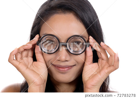 Portrait of young woman with eyeglasses Portrait of young woman with eyeglasses 72783278