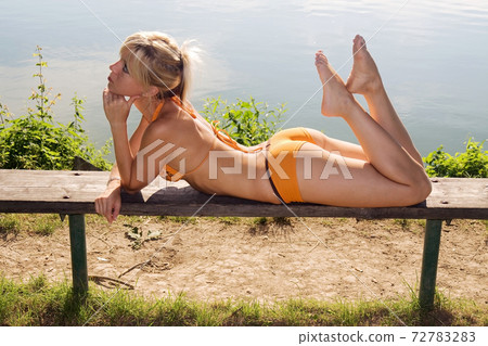 A sunbathing girl A sunbathing girl 72783283