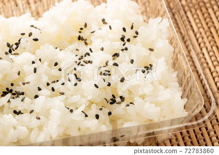 Rice sprinkled with salt and pepper in a take-out container. Rice sprinkled with salt and pepper in a take-out container. 72783860