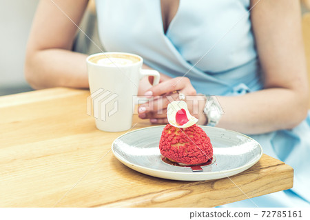 Woman with tasty piece of cake and cup of coffee in cafe close up. Woman with tasty piece of cake and cup of coffee in cafe close up. 72785161