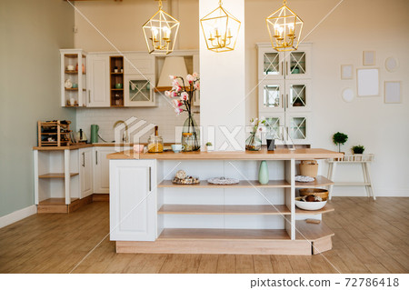 bright Scandinavian-style kitchen with a small island. design bright Scandinavian-style kitchen with a small island. design 72786418