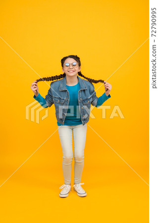 happy girl jumping high. little schoolgirl in glasses. full happy girl jumping high. little schoolgirl in glasses. full 72790995