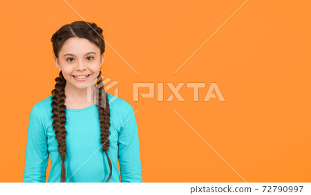 happy child girl with healthy smile has fashionable hairstyle on yellow background, happiness happy child girl with healthy smile has fashionable hairstyle on yellow background, happiness 72790997