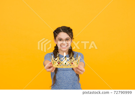 Luxury and gorgeous. Happy girl hold luxury crown. Handing Luxury and gorgeous. Happy girl hold luxury crown. Handing 72790999