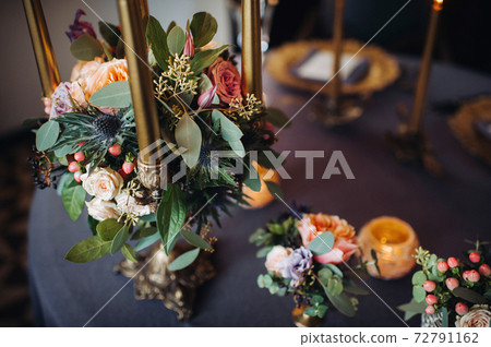 wedding table decoration with flowers on the table in the castle, table decor for dinner by candlelight.Dinner with candles 72791162
