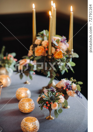 wedding table decoration with flowers on the table in the castle, table decor for dinner by candlelight.Dinner with candles 72791164
