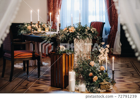 wedding table decoration with flowers on the table in the castle, table decor for dinner by candlelight.Dinner with candles 72791239