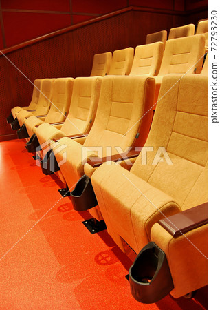 Modern cinema hall empty and beige comfortable seats 72793230