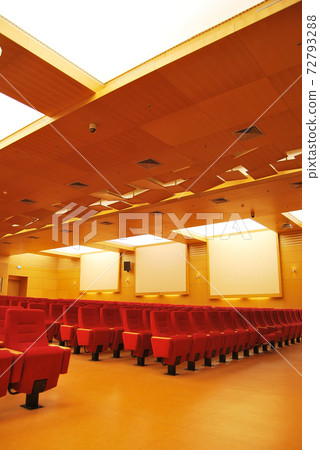 Modern cinema hall empty and red comfortable seats Modern cinema hall empty and red comfortable seats 72793288