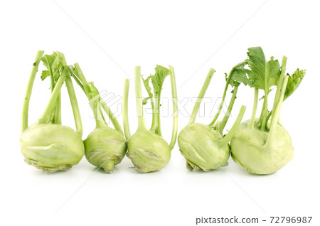 Fresh kohlrabi with green leaves on isolated white background Fresh kohlrabi with green leaves on isolated white background 72796987