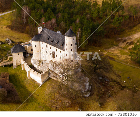 Morning aerial view on the medieval royal castle Bobolice. Poland 72801010