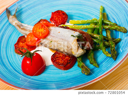 Poutassou baked with dried tomatoes, asparagus, creamy garlic sauce 72801054