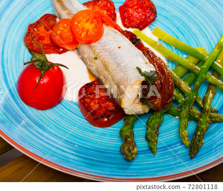 Blue whiting fish baked with dried tomatoes 72801118