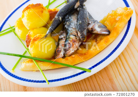 Anchovies with potato croquettes and flatbread Anchovies with potato croquettes and flatbread 72801270