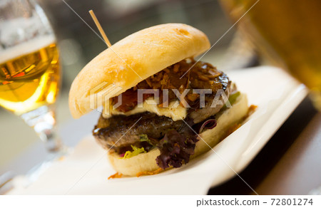 Tasty burger served in cafe Tasty burger served in cafe 72801274