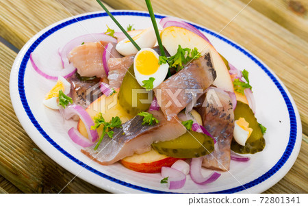 Herring salad with apples and cucumbers 72801341