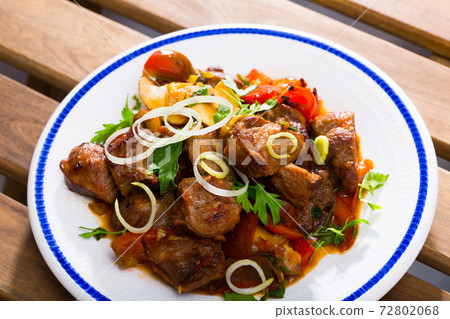 Meat baked with mushrooms and vegetables Meat baked with mushrooms and vegetables 72802068