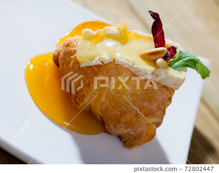 Croissant with camembert and honey Croissant with camembert and honey 72802447