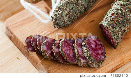 Sliced spanish sausage fuet with herbs Sliced spanish sausage fuet with herbs 72802540