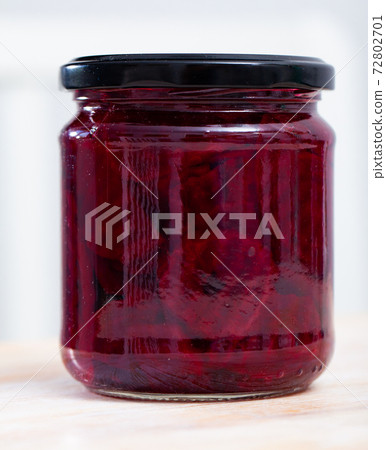 Glass jar of homemade pickled beetroot 72802701