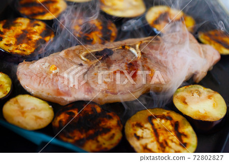 Pork shoulder roasted with eggplants in fry pan Pork shoulder roasted with eggplants in fry pan 72802827
