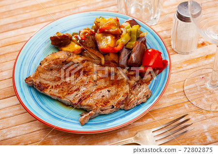 Appetizing beef entrecote with baked vegetables Appetizing beef entrecote with baked vegetables 72802875