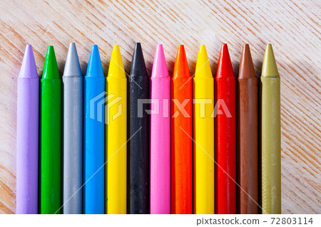 Multicolored crayon pencils on wooden surface Multicolored crayon pencils on wooden surface 72803114