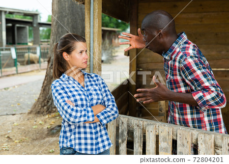 Woman having unpleasant talk with neighbour 72804201