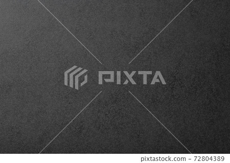 Textured black paper background texture 72804389
