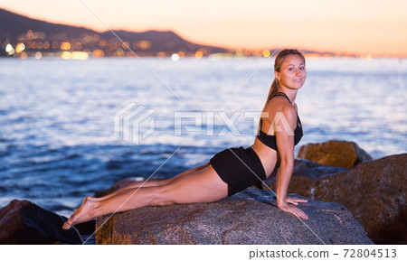 Female is practicing stretching 72804513