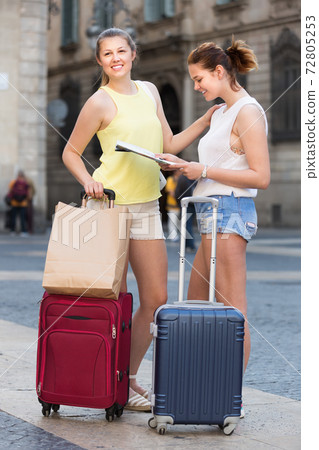 Women with paper map searching for the direction Women with paper map searching for the direction 72805253