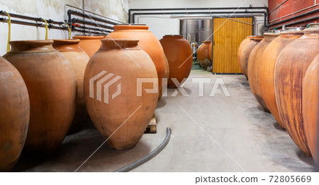 Wine cellar. Ceramic large jugs with wine in cellar Wine cellar. Ceramic large jugs with wine in cellar 72805669