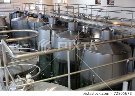 Interior of winery with stainless steel tanks Interior of winery with stainless steel tanks 72805678