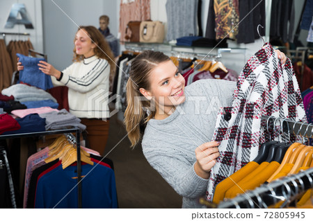 Female customers shopping in clothing store Female customers shopping in clothing store 72805945