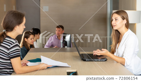 Woman notary receiving customers 72806154