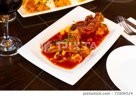 Asian sticky pork ribs on plate closeup 72806524