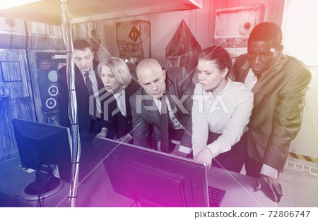 Toned image of businesspeople solving together conundrum 72806747