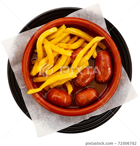 Chorizo with cider served with french fries Chorizo with cider served with french fries 72806782