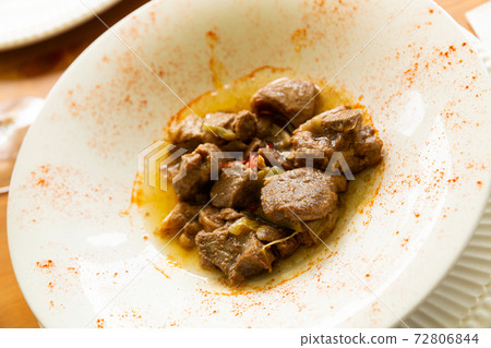 Appetizing lamb stewed with young garlic and paprika 72806844