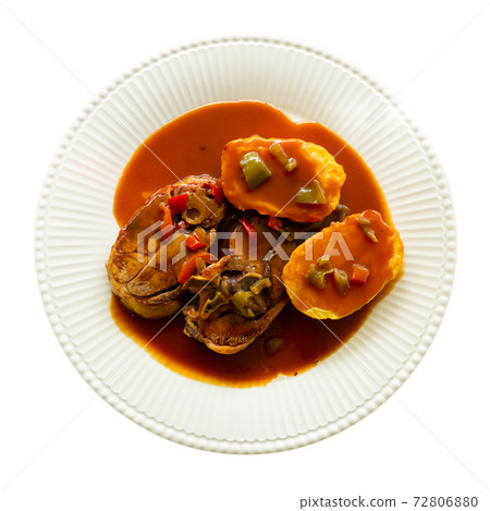 Tasty lamb meat baked and served with sauce and potatoes Tasty lamb meat baked and served with sauce and potatoes 72806880